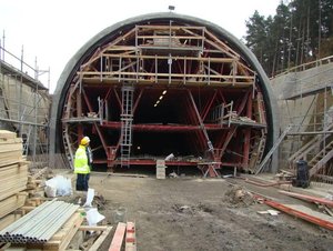 The Osek tunnel – travelling formwork under the “false” primary lining